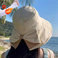 Cappello da donna con fiocco e tesa larga per proteggersi dal sole