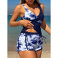 Completo composto da tankini a vita alta e shorts con stampa tropicale.