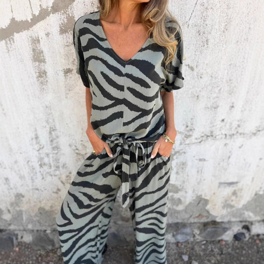 Completo due pezzi da donna con top a V e pantaloni con stampa zebrata